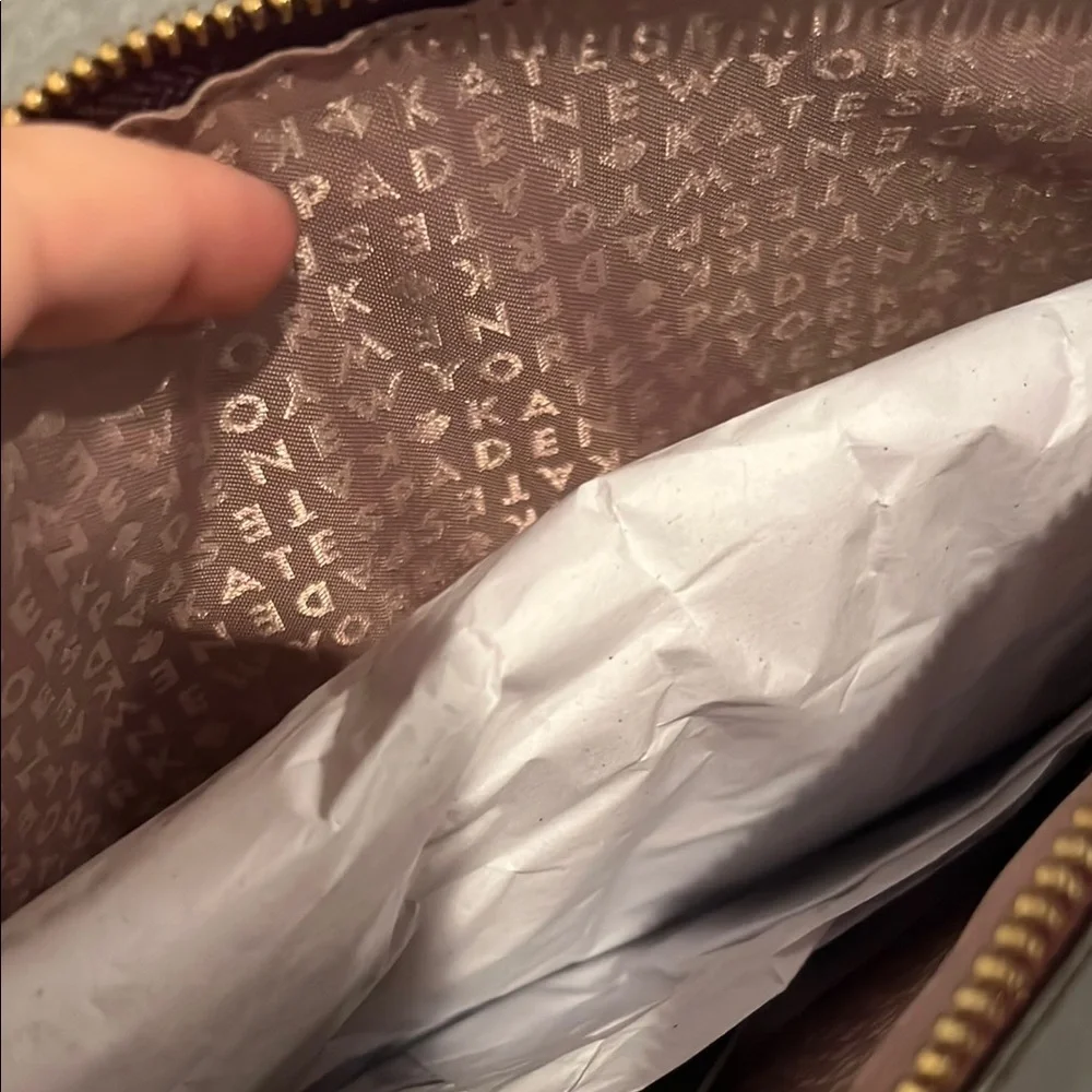 NWT kate spade burgundy suede pouch with gold logo